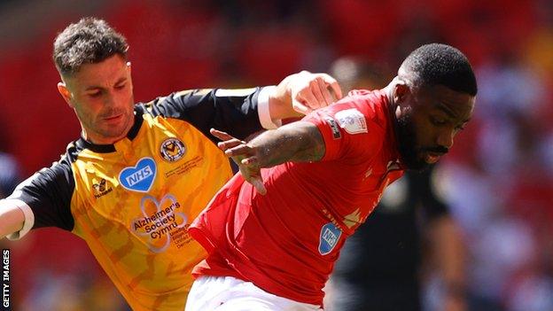 Yann Songo'o (right) put in a superb performance at Wembley in Morecambe's League Two play-off final win over Newport County in May