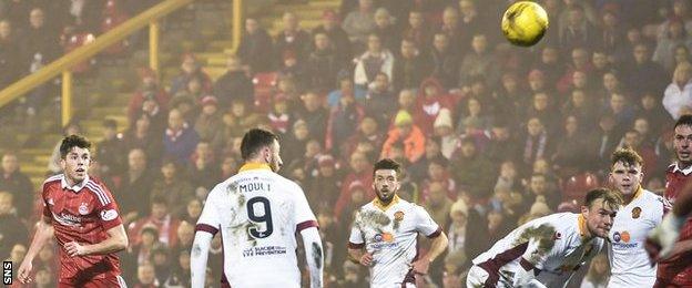 Ryan Christie watches his delightful left-foot dink curl into the top corner to make it 4-0