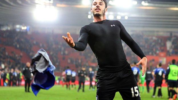 Adam Smith throws his Bournemouth shirt into the crowd at Southampton