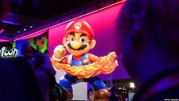 A Super Mario display at the Nintendo section attracts attention at the annual E3 video game extravaganza in Los Angeles, California on June 10, 2014