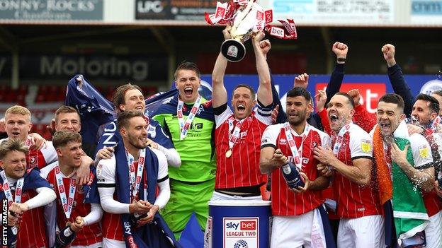 Cheltenham celebrate with the League Two trophy