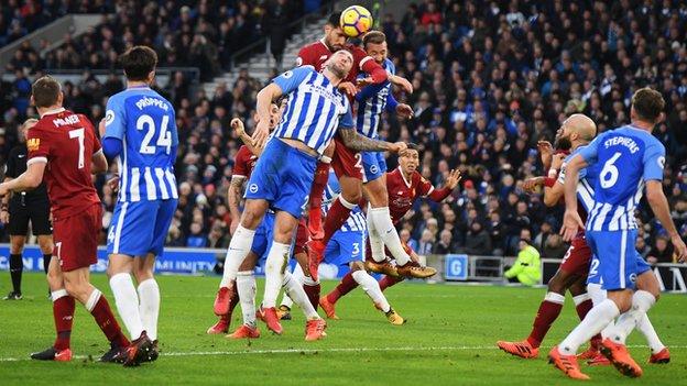 Emre Can heads Liverpool's first goal against Brighton