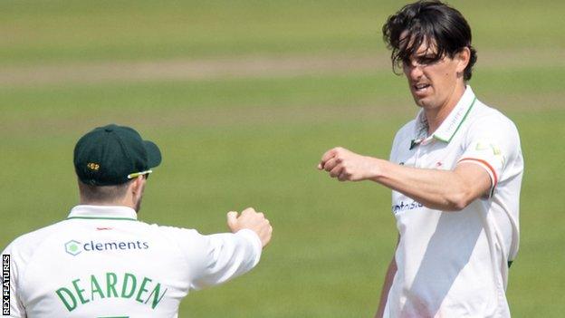 Chris Wright celebrates taking his fifth wicket in Gloucestershire's first innings