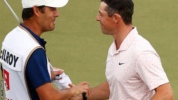 Harry Diamond and Rory McIlroy celebrate victory at Quail Hollow