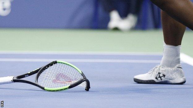 Serena Williams' smashed racquet on the court at Arthur Ashe Stadium