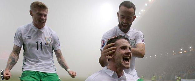 Robbie Brady is congratulated by Republic team-mate Marc Wilson after scoring his goal