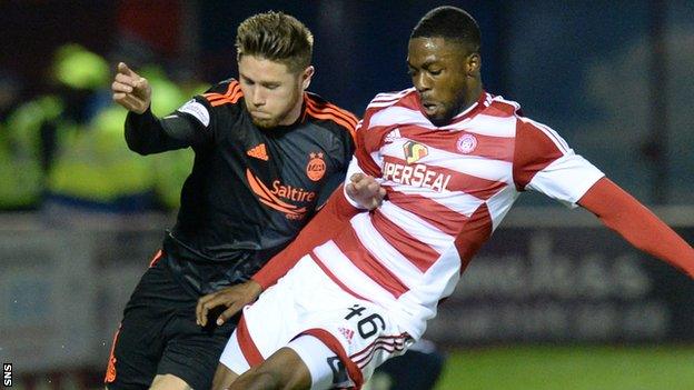 Aberdeen's Wes Burns (left) battles for the ball against Hamilton's Lennard Sowah