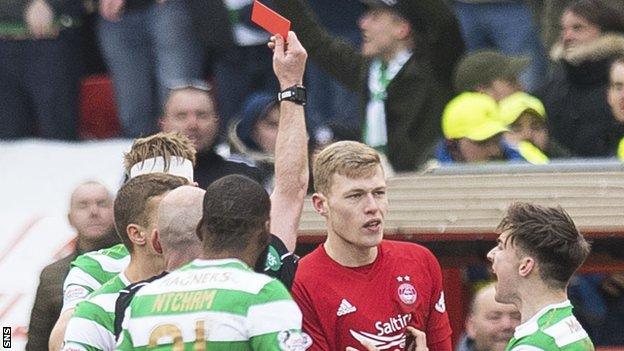 Aberdeen's Sam Cosgrove is shown a red card by referee Bobby Madden