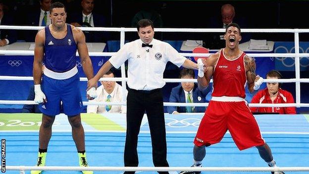 Joe Joyce looks dejected as James Yoka is named Olympic champion