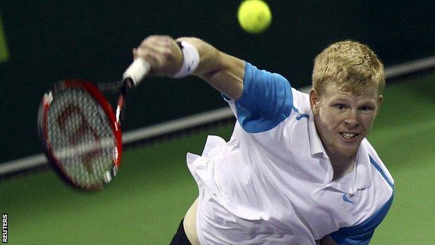 Kyle Edmund hits a serve