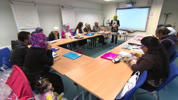 A picture of a lesson taking place to teach Syrian refugees how to survive in the UK