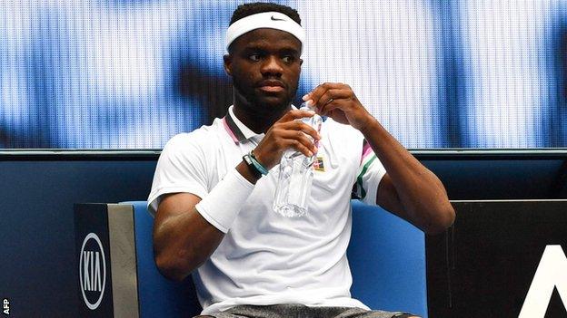 Frances Tiafoe has a drink