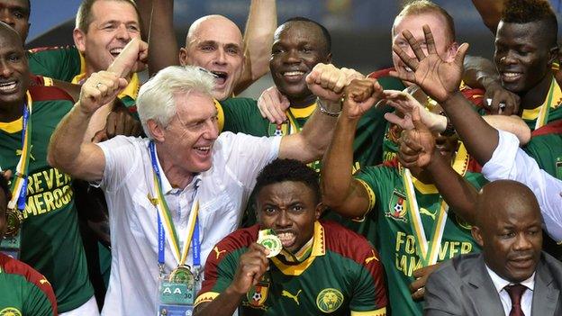 Cameroon and coach Hugo Broos celebrate their 2017 Africa Cup of Nations triumph