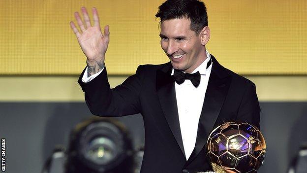 Lionel Messi with the Ballon d'Or in 2015