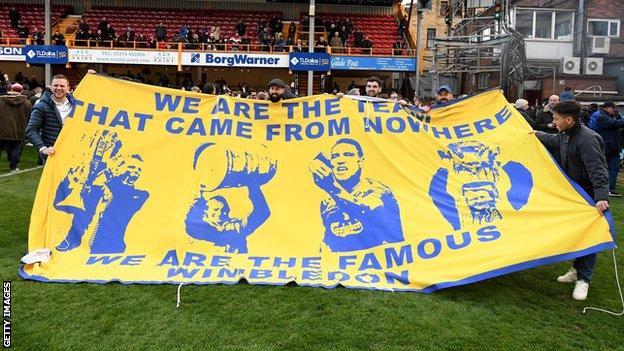 AFC Wimbledon fans at their final League One game of the 2018-19 season at Bradford City