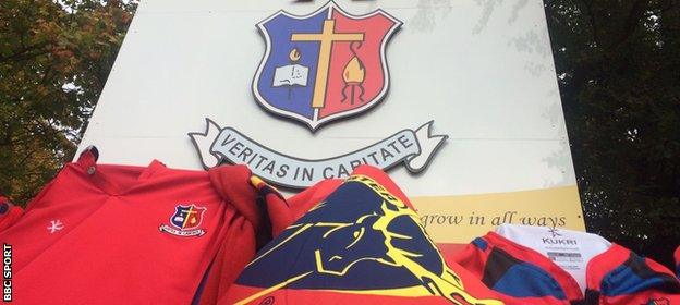 The shirts of Munster and St Munchin's College line the gates at Anthony Foley's old school