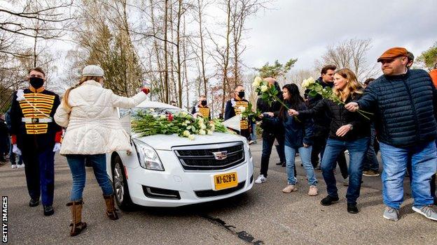 Mourners line the streets during Mentel-Spee's funeral ceremony