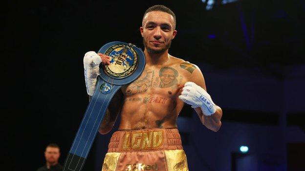 Zelfa Barrett poses with his title