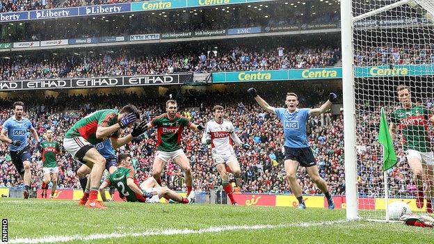 Despair for Mayo's Kevin McLoughlin as he diverts the ball into his own net in the All-Ireland final