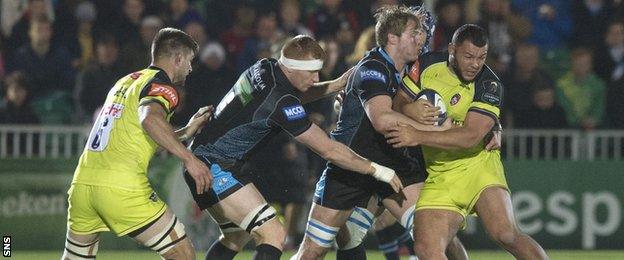 Glasgow forwards Rob Harley and Jonny Gray tackle Leicester's Ellis Genge