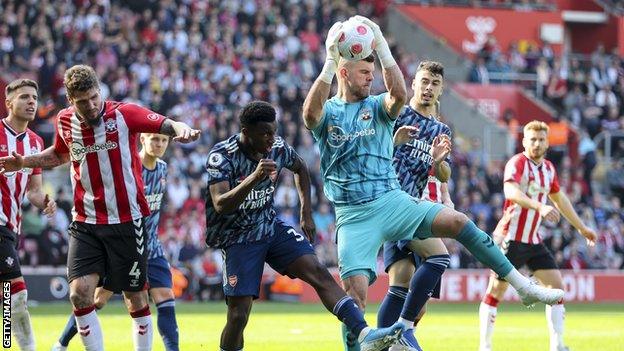 Forster commands his area against Arsenal.