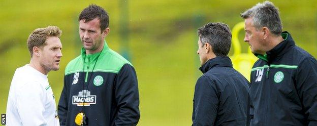 Celtic's Kris Commons, Ronny Deila and John Collins chat during training