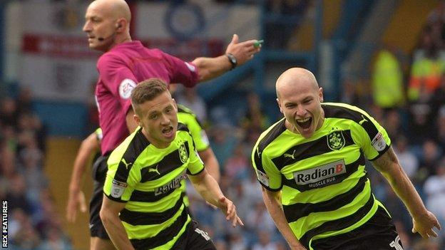 Aaron Mooy celebrates his winning goal for Huddersfield against Leeds