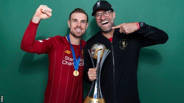 Liverpool captain Jordan Henderson and Reds boss Jurgen Klopp, pictured with the Club World Cup trophy