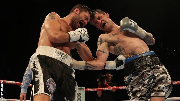 Kiryl Relikh and Ricky Burns exchange ferocious body punches in their 12-round bout