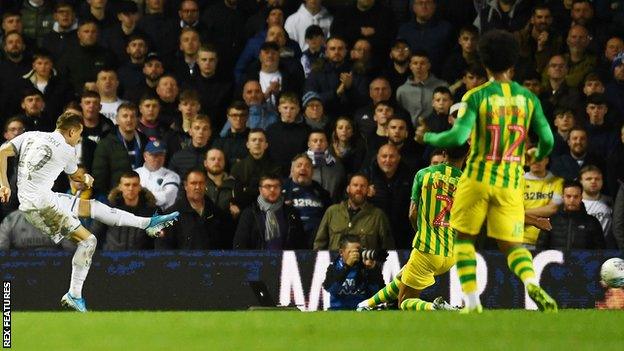 Ezgjan Alioski of Leeds United scores a goal to make it 1-0 against West Brom