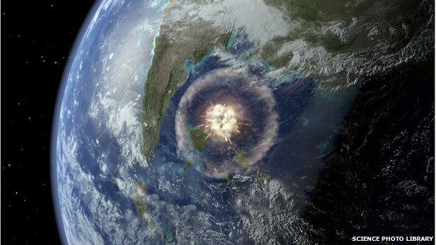 Computer artwork of a large asteroid hitting Earth 65 million years ago.