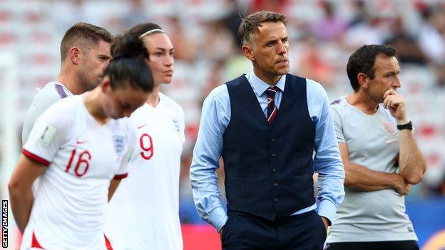 England women's boss Phil Neville, players and coaches look on after third-place play-off defeat by Sweden at the 2019 World Cup