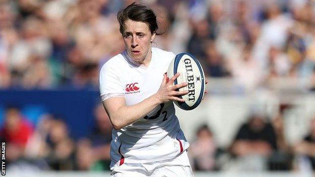 Katy Daley-Mclean runs with the ball while playing for England