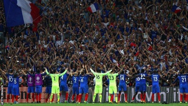 France's players celebrate their semi-final win with their fans