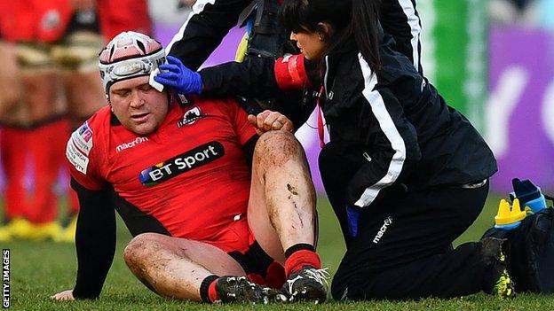 WP Nel receives treatment during his comeback for Edinburgh against Harlequins