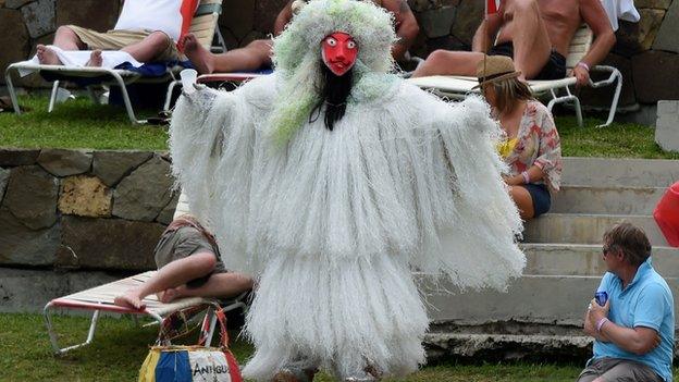 A fan dressed in fancy dress in Antigua in 2015