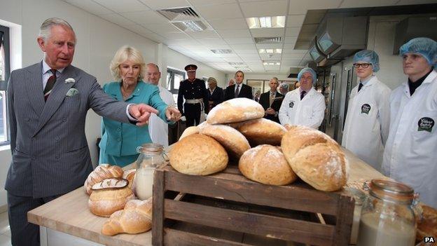 The Prince of Wales and Duchess of Cornwall visit a bakery in Wrexham