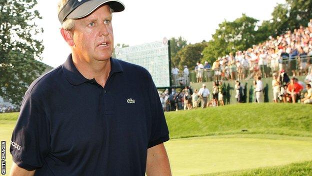 Colin Montgomerie leaves the 18th green at Winged Foot