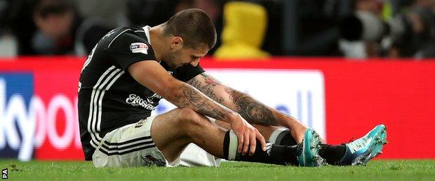 Aleksandar Mitrovic sits on the ground