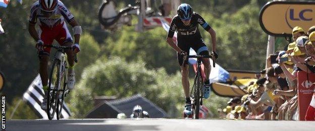 Joaquim Rodriguez leads Chris Froome to the finish of stage three of the tour de France in Huy