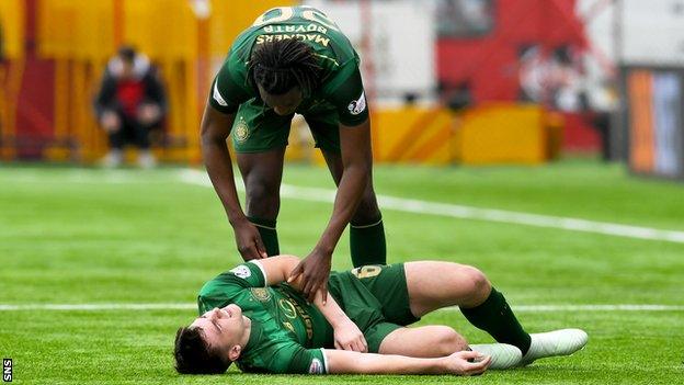 Celtic's Kieran Tierney lies injured on Hamilton's artificial surface