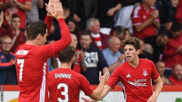 Ryan Christie (right) opened the scoring at Pittodrie with a fine strike