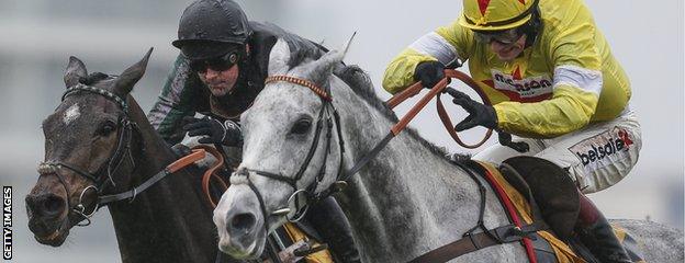 Nico de Boinville riding Altior (L) clear the last to win The Betfair Exchange Steeple Chase from Politolouge (R) at Newbury racecourse on February 10, 2018 in Newbury