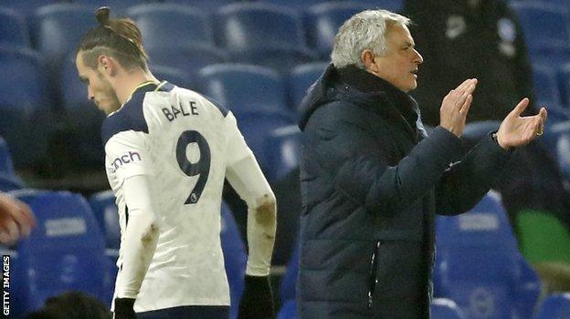 Gareth Bale walks past Jose Mourinho after being substituted during Tottenham's game with Brighton