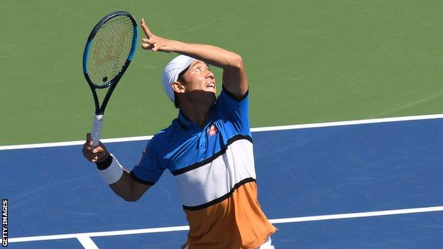 Kei Nishikori prepares to hit an overhead shot