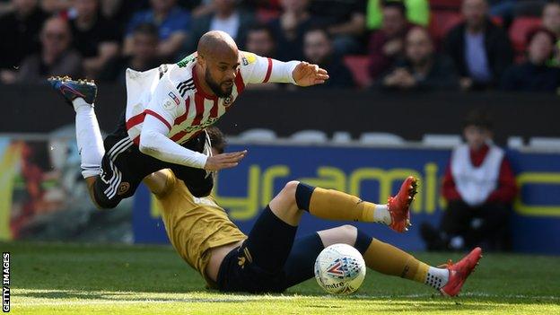 Yohan Benalouane fouls David McGoldrick.