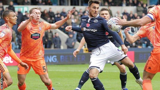 Lee Gregory volleys in his first goal for Millwall against Ipswich