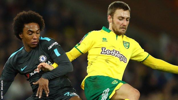 Tom Trybull (right) battles for the ball with Chelsea's Willian