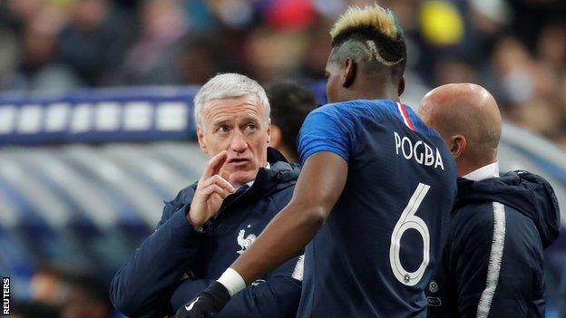 Didier Deschamps gives instructions to Paul Pogba