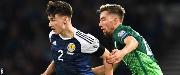 Scotland's Kieran Tierney holds off Slovenia's Kevin Kampl